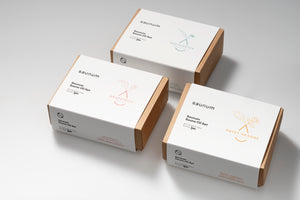 Three 'saunum' branded boxes on a light gray background
