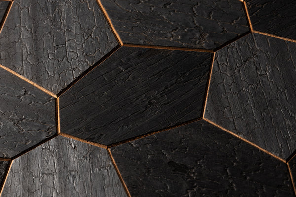 Hexagonal black tiles with a textured surface