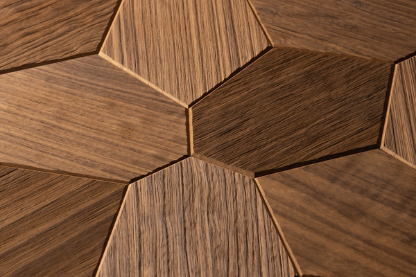 Close-up of hexagonal wooden tiles with a brown finish