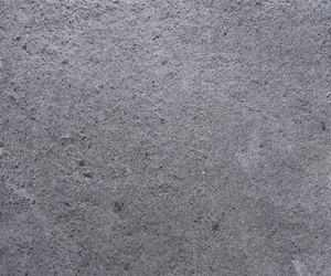 Soapstone surface for electric sauna heater casing in natural grey stone finish