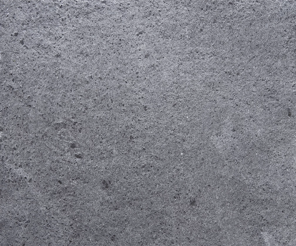 Soapstone surface for electric sauna heater casing in natural grey stone finish