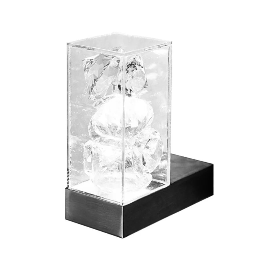 Crystal light in a clear glass box on a white background